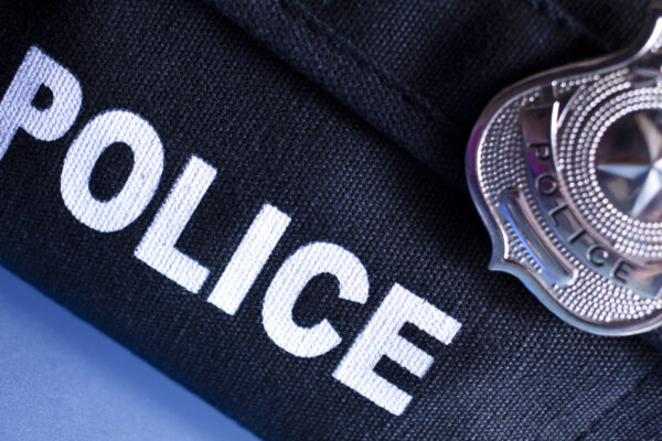 Policeman's bulletproof vest and badge.
